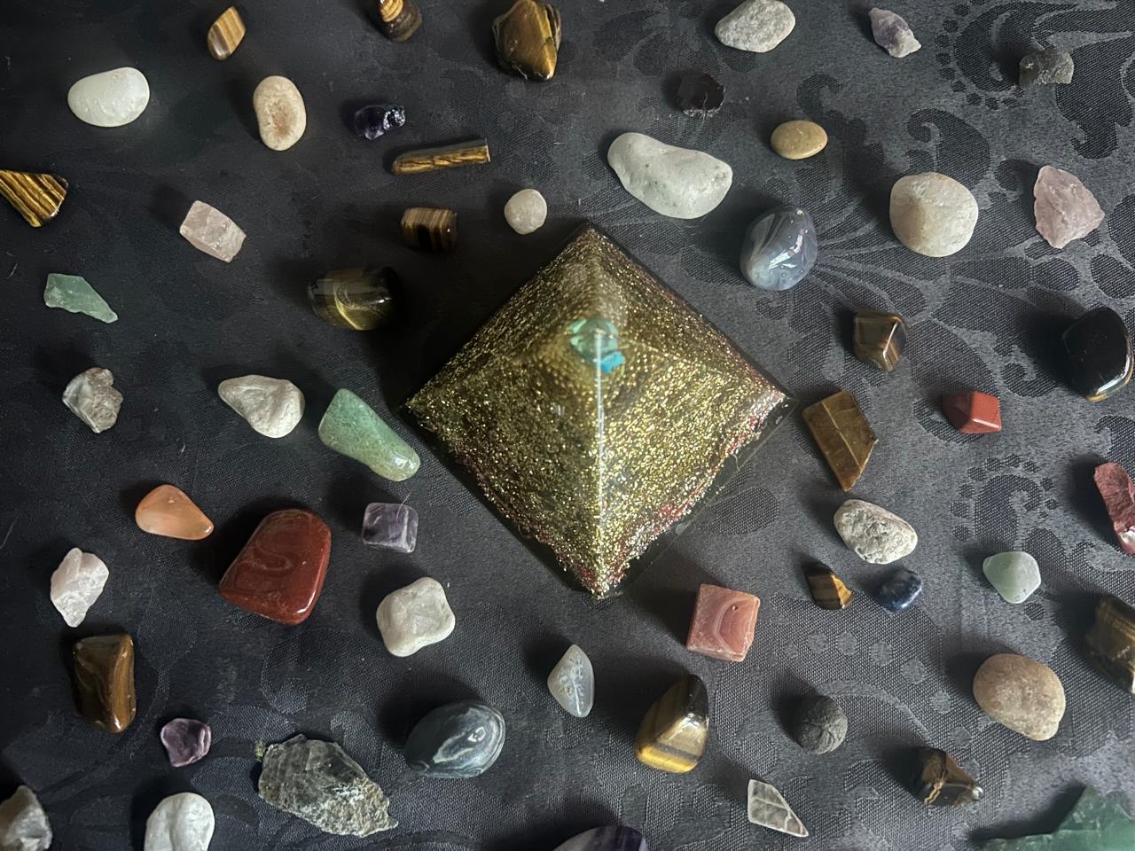Pyramid surrounded by precious stones